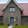 A single-family house covered with chestnut engobe Bornholm tiles