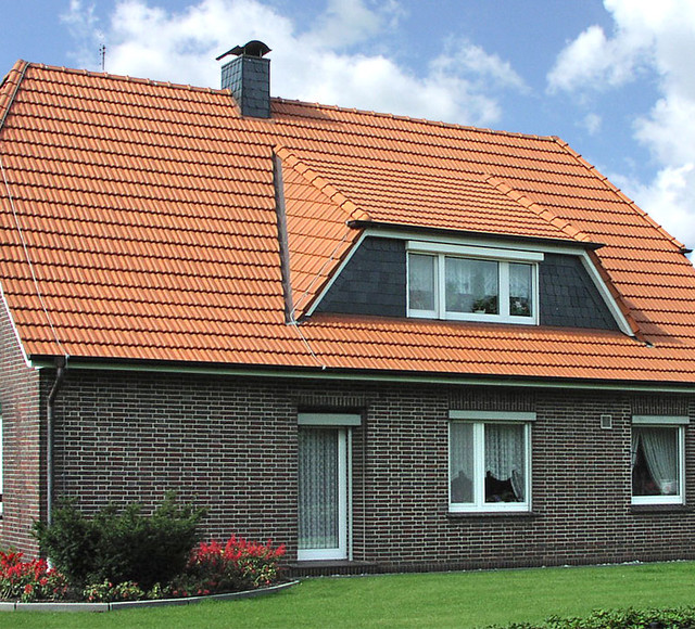 A single-family house covered with natural red Elsss tiles